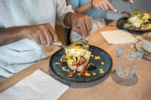 Close up of mushroom and egg on toast with a sauce