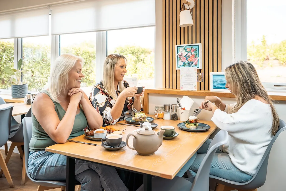 Three women enjoying breakfast together
